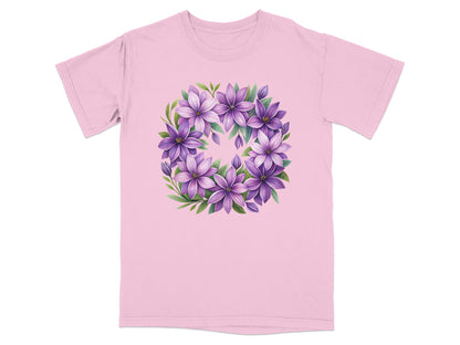 Pink t-shirt with a circular floral design of purple clematis flowers.