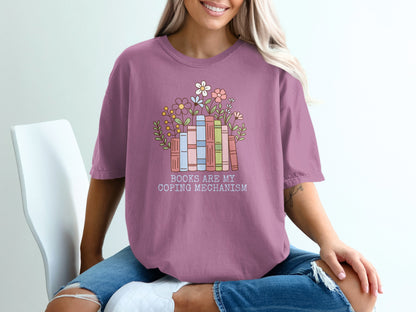 T-shirt with stacked books and flowers, reads "Books Are My Coping Mechanism".