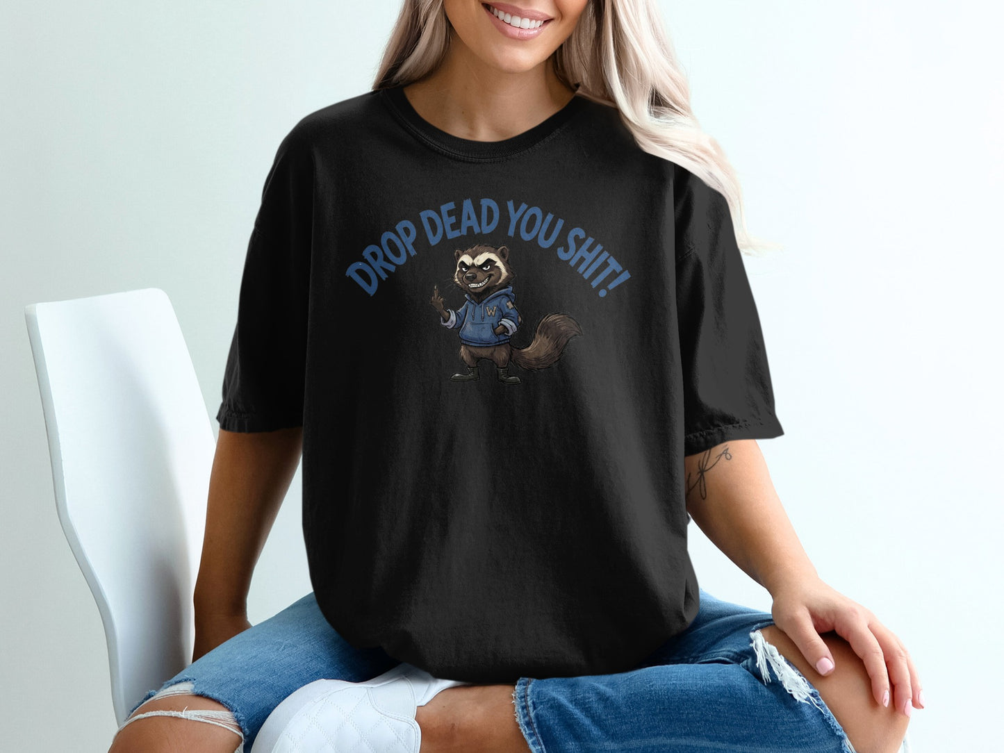 Black t-shirt with raccoon graphic and text "DROP DEAD YOU SH*T!".