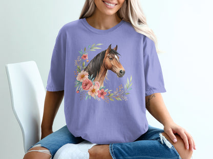 Horse head illustration with floral wreath on a lavender t-shirt.
