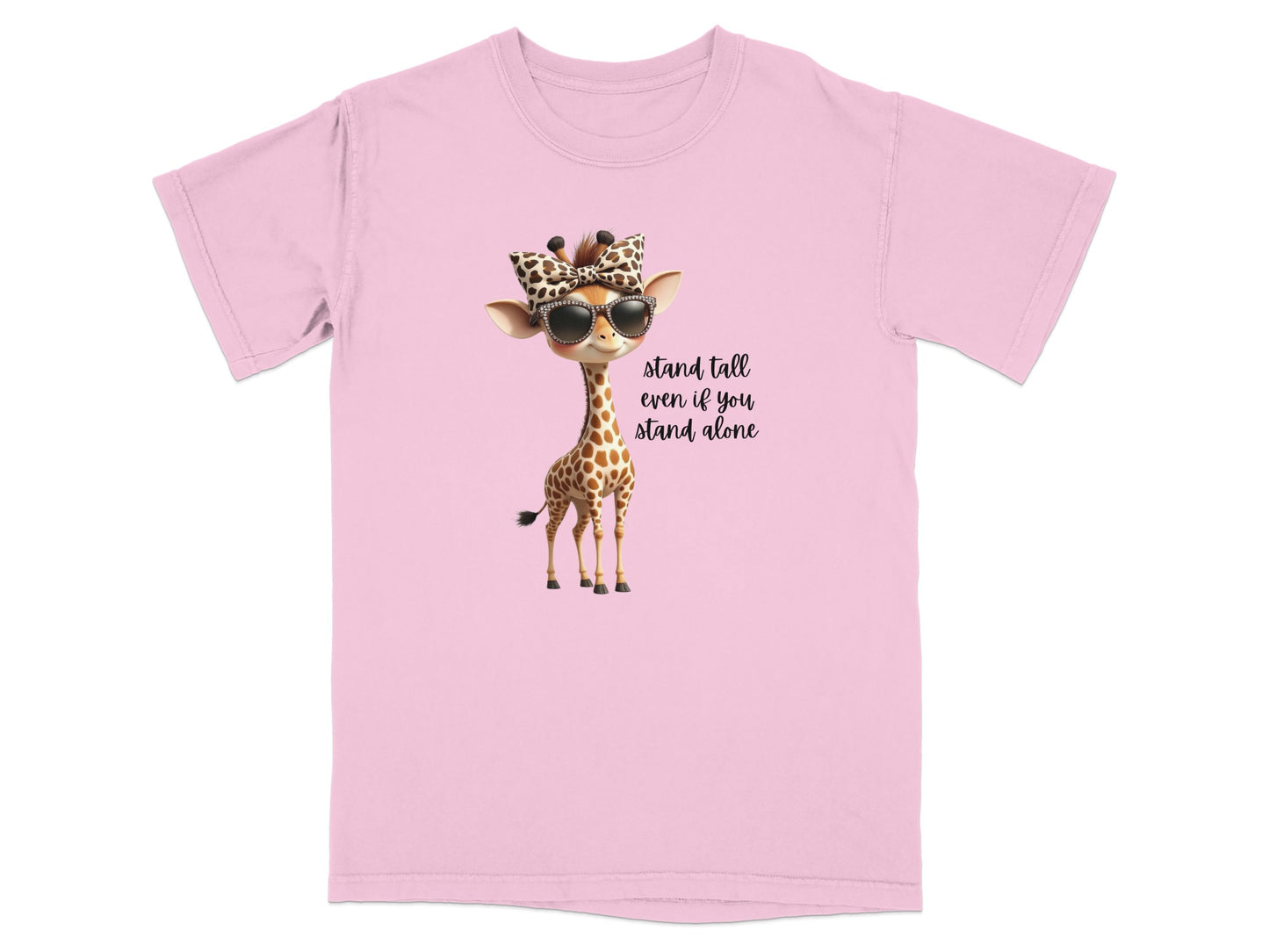Pink t-shirt with a cartoon giraffe wearing sunglasses and a bow, text reads "Stand tall even if you stand alone".