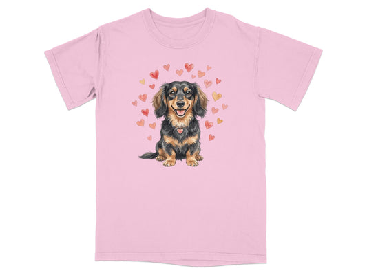 Pink t-shirt with a watercolor illustration of a dachshund wearing a heart pendant.
