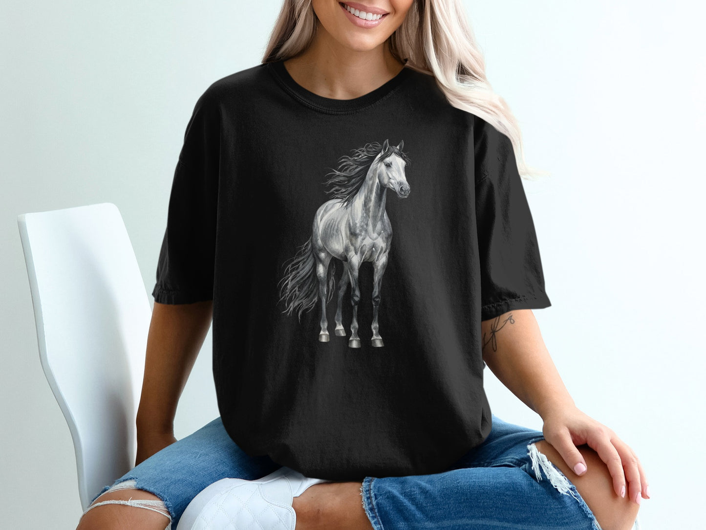 Black t-shirt featuring a detailed grayscale illustration of a standing horse.