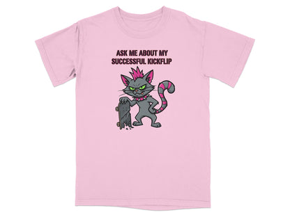Pink t-shirt with cartoon cat in punk attire holding a skateboard.
