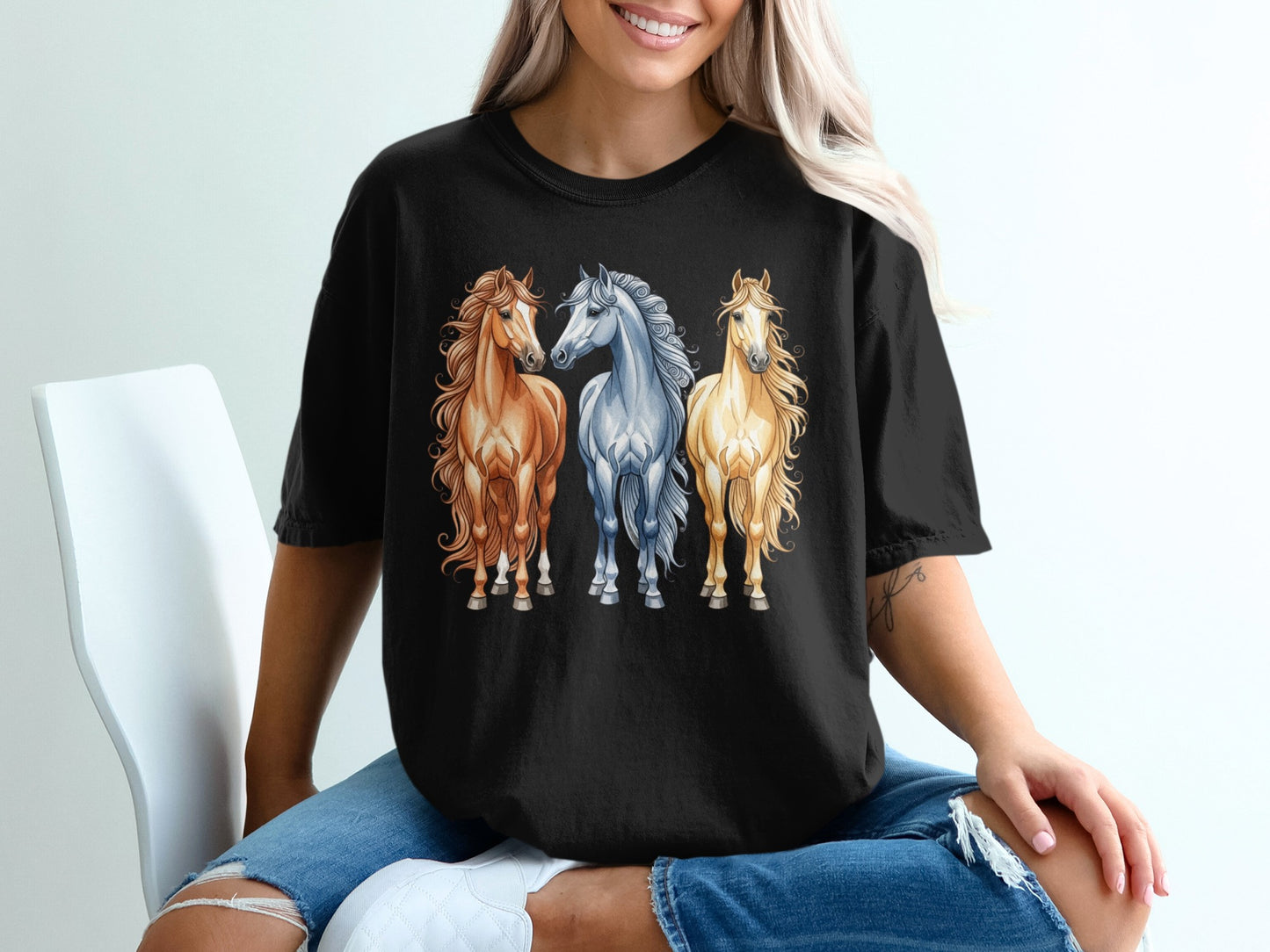 Three horses, two light brown and one golden, stand side-by-side.