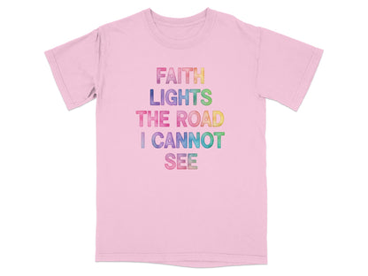 Pink t-shirt with "FAITH LIGHTS THE ROAD I CANNOT SEE" in colorful watercolor text.