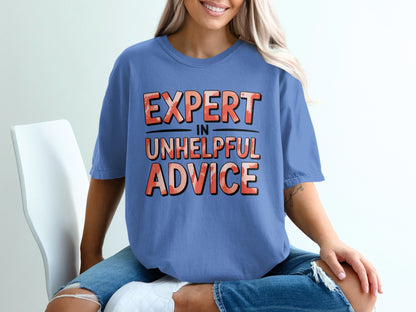 Blue t-shirt with "EXPERT IN UNHELPFUL ADVICE" text in distressed orange and white.