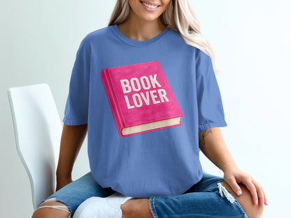 Blue t-shirt featuring a pink book with "BOOK LOVER" text.