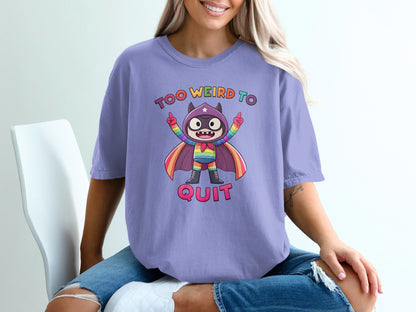 Purple t-shirt with a cartoon superhero and text "TOO WEIRD TO QUIT".
