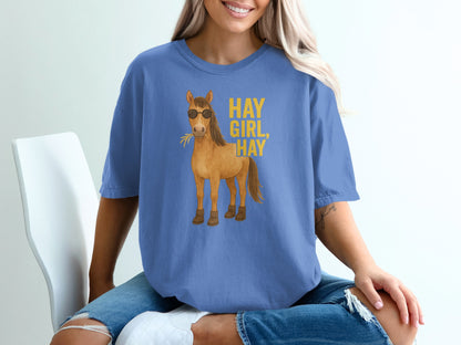 Blue t-shirt with sunglasses-wearing horse and "HAY GIRL HAY" text.