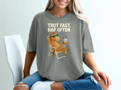 Graphic tee with cartoon horse in beach chair, text "Trot Fast, Nap Often."