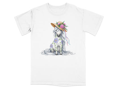 White t-shirt with a seated unicorn wearing a straw hat with flowers.