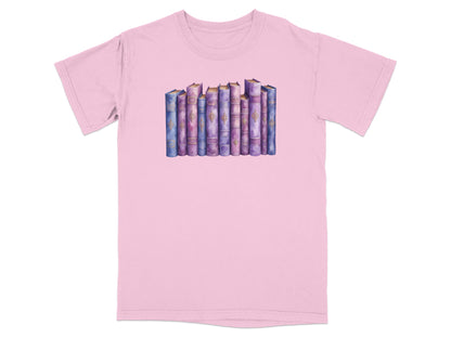 Watercolor illustration of a row of antique books with gold trim on a pink t-shirt.
