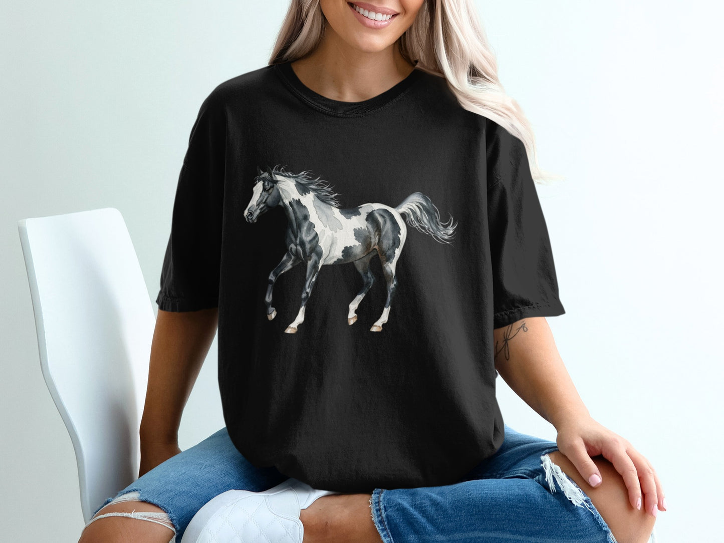 Black t-shirt featuring a black and white horse design.