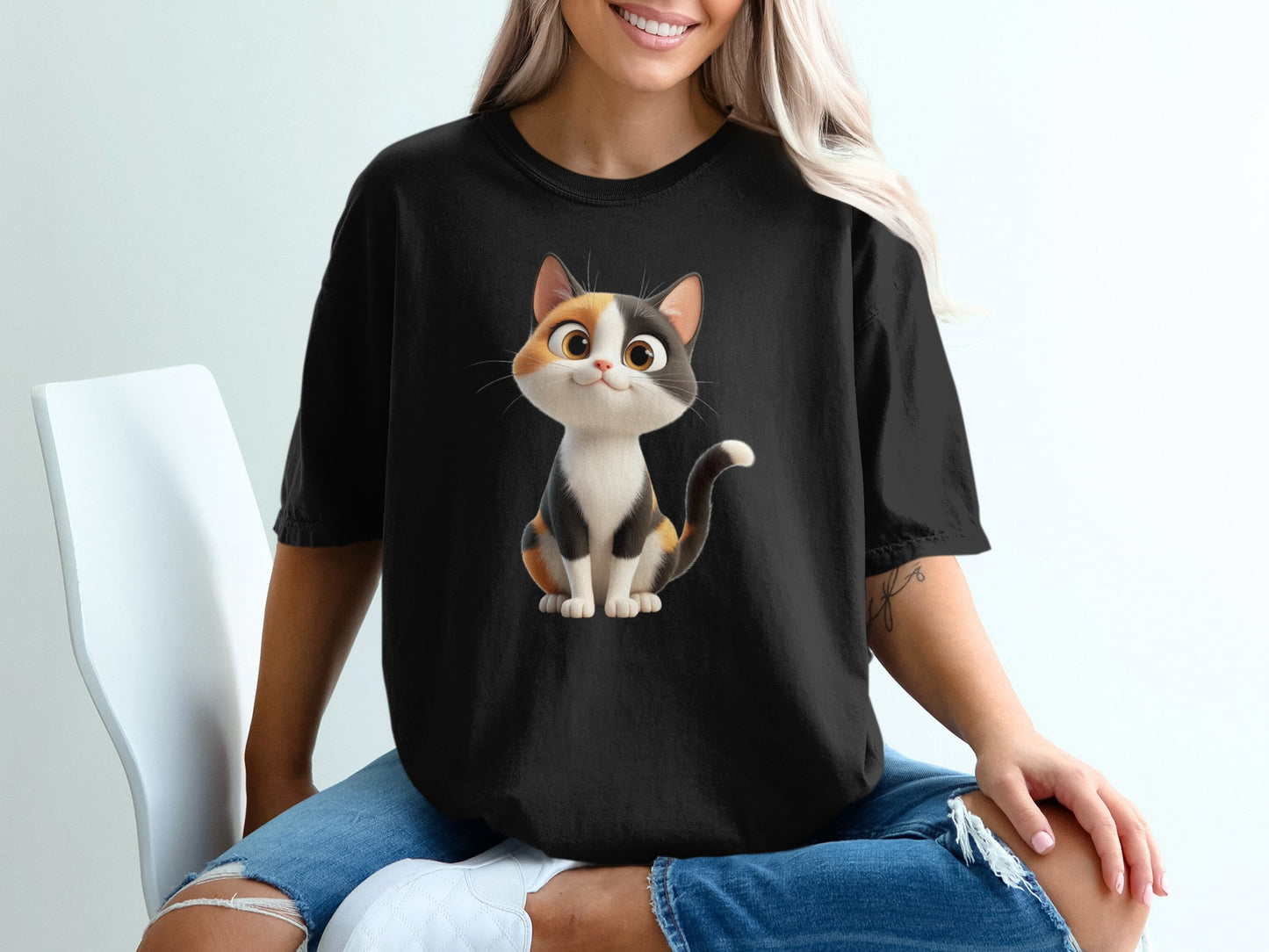 Black t-shirt featuring a cartoon ginger and white cat graphic.