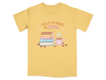 Yellow t-shirt with "Fueled by Books & Coffee" text and stack of books.