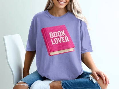 Purple t-shirt with a pink book graphic that says "BOOK LOVER".