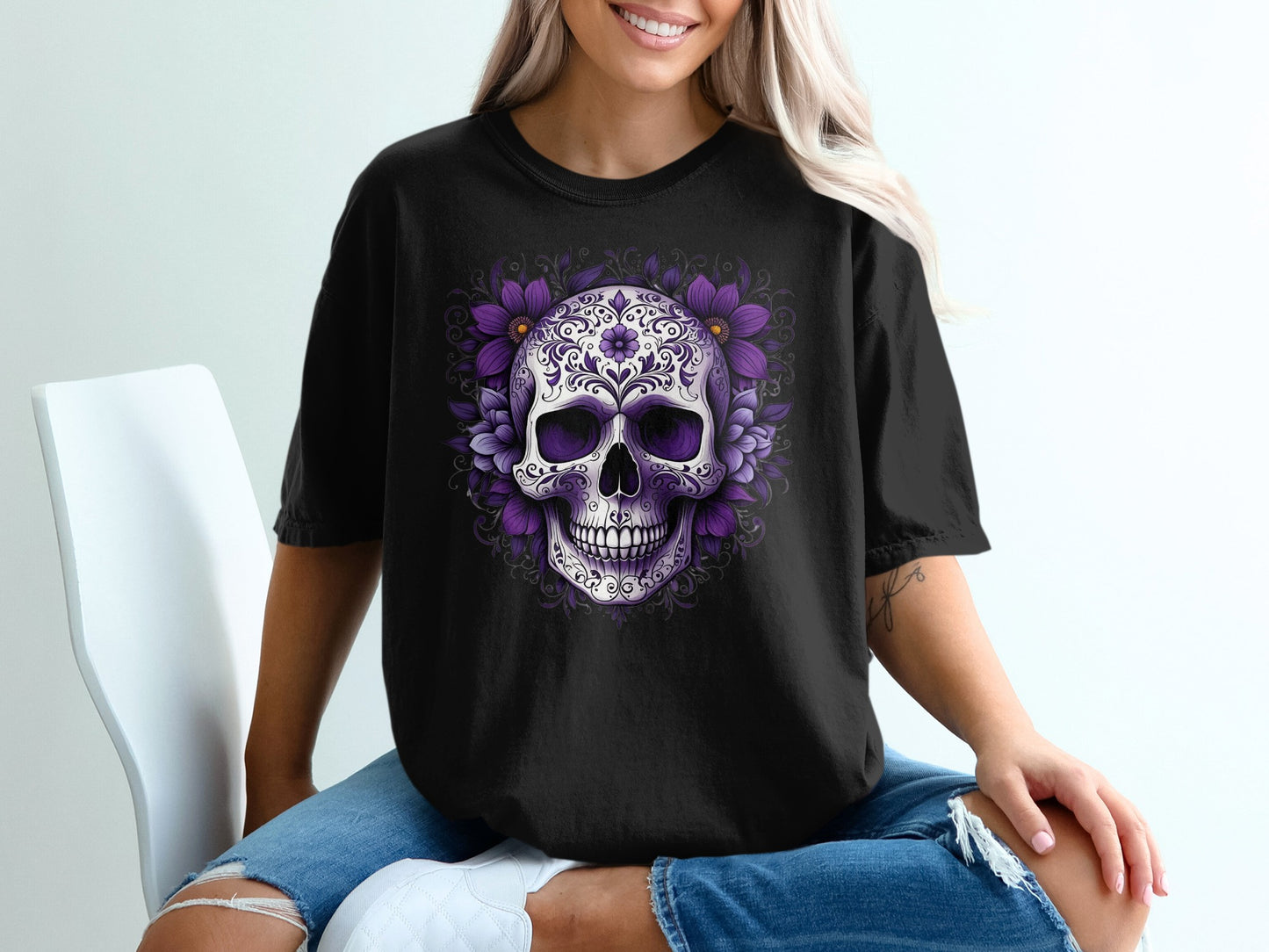Black t-shirt with a purple floral skull graphic.