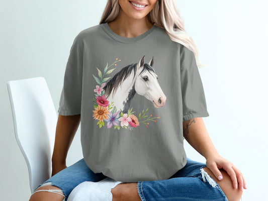 Horse head with colorful floral wreath on gray t-shirt.