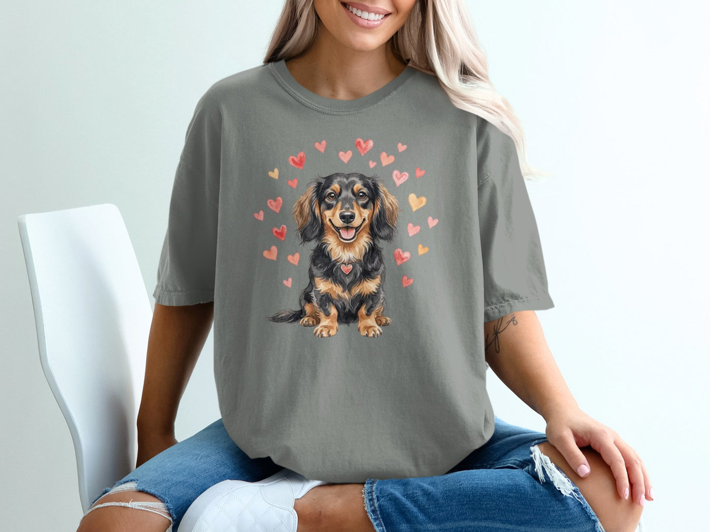 Gray t-shirt with watercolor dachshund and hearts graphic.