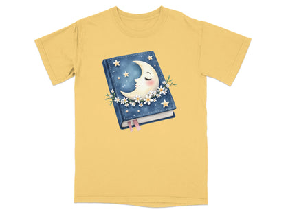 Yellow t-shirt with a celestial moon and book graphic.