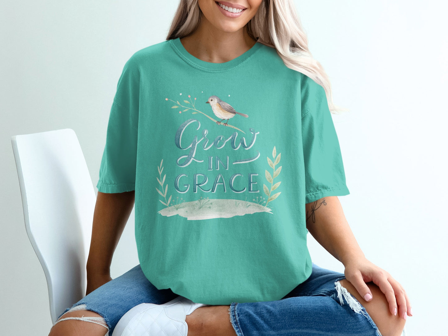 Teal t-shirt with "Grow in Grace" text and a bird on a branch.
