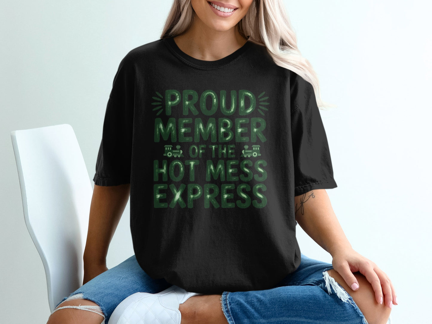 Black t-shirt with green text "Proud Member of the Hot Mess Express".
