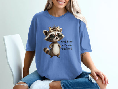 T-shirt with cartoon raccoon wearing sunglasses and a leopard print bow.