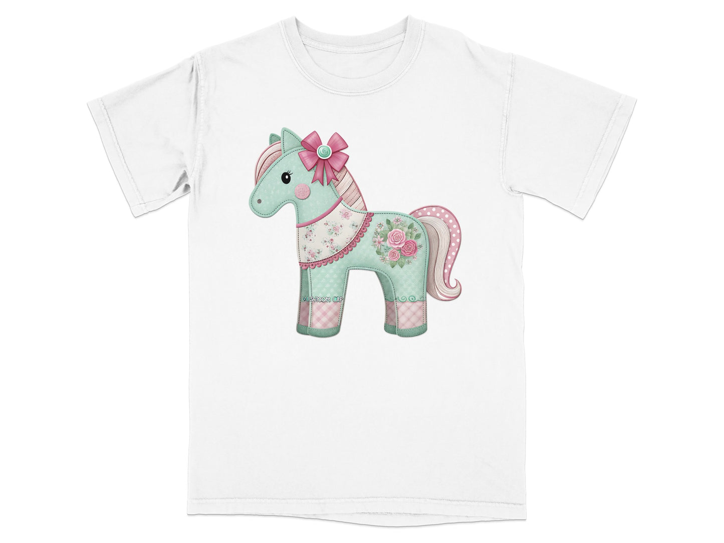 White t-shirt with a cartoon horse graphic featuring pastel colors and floral accents.
