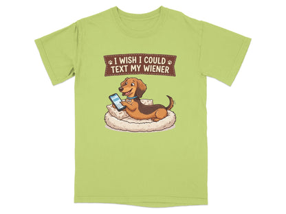Dachshund on pillow with phone, text reads "I wish I could text my wiener".