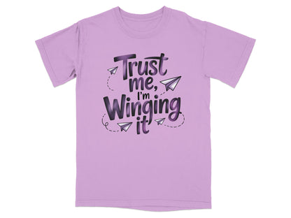 Purple t-shirt with "Trust me, I'm Winging It" and paper airplanes.