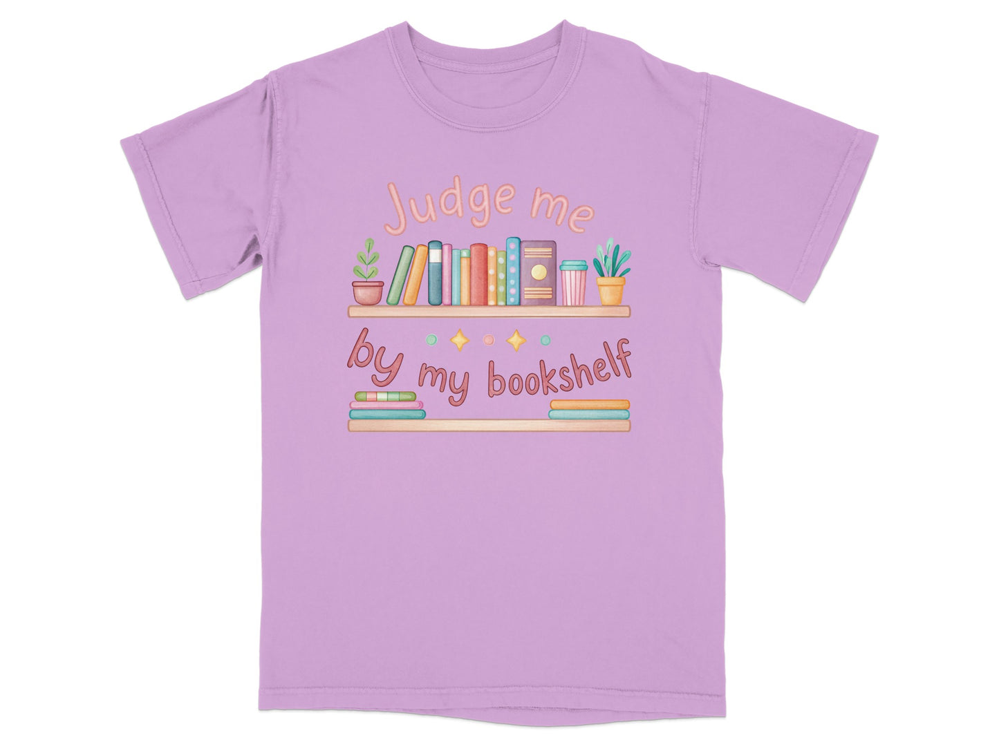 T-shirt with "Judge me by my bookshelf" text and a colorful illustration of a bookshelf.