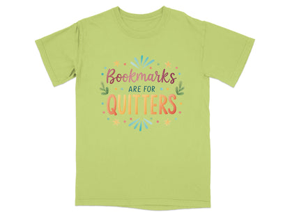 Light green t-shirt with "Bookmarks are for quitters" text and colorful decorations.