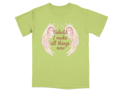 Light green t-shirt with pink wings and text "Behold, I make all things new".