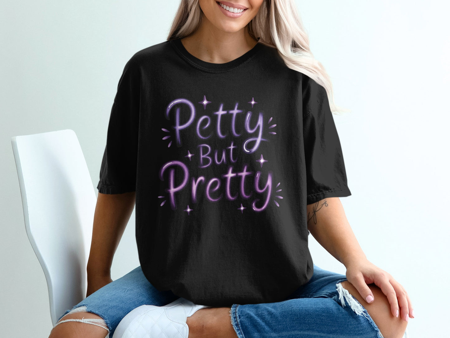 Black t-shirt with purple glitter text "Petty But Pretty"