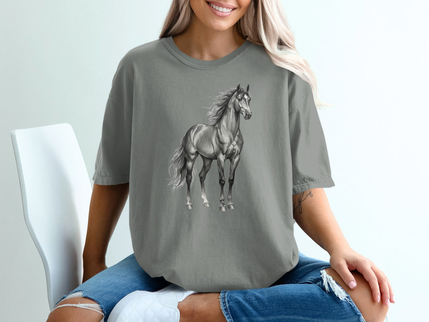 Gray t-shirt with a realistic illustration of a majestic horse in motion.