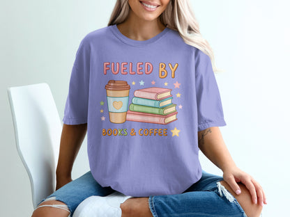 Purple t-shirt with "Fueled by Books & Coffee" text and stacked books.