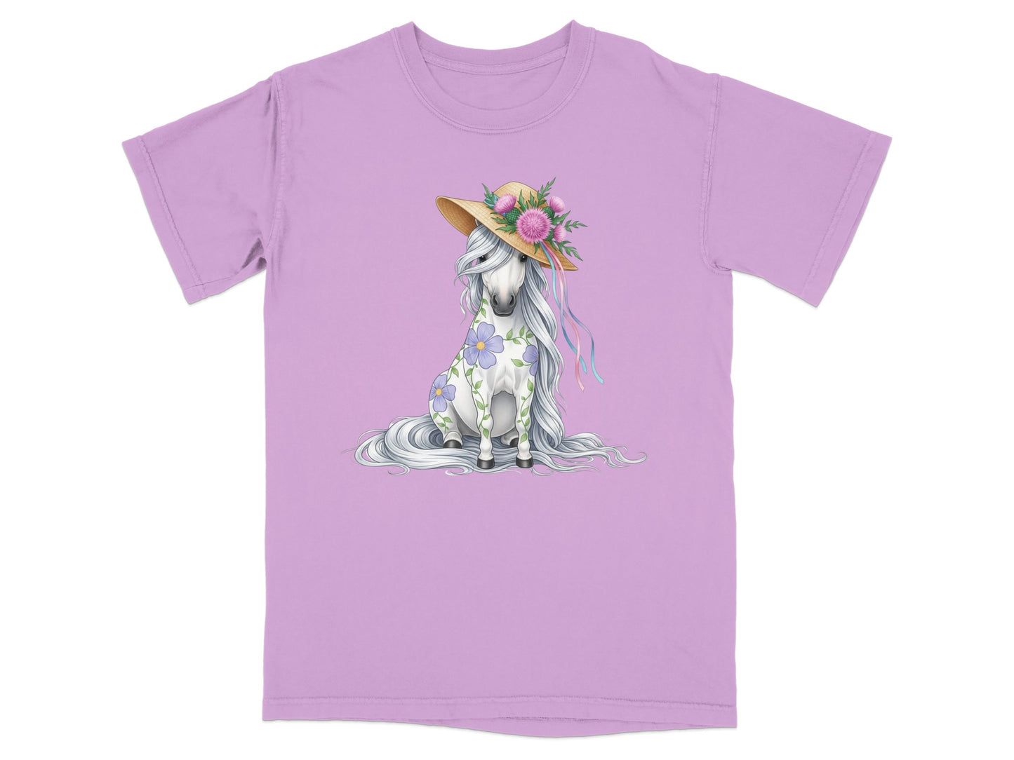 Unicorn wearing a straw hat with flowers, sitting on a purple t-shirt.