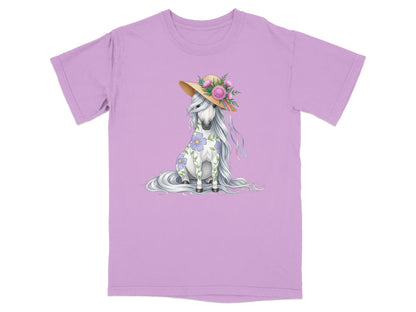 Unicorn wearing a straw hat with flowers, sitting on a purple t-shirt.