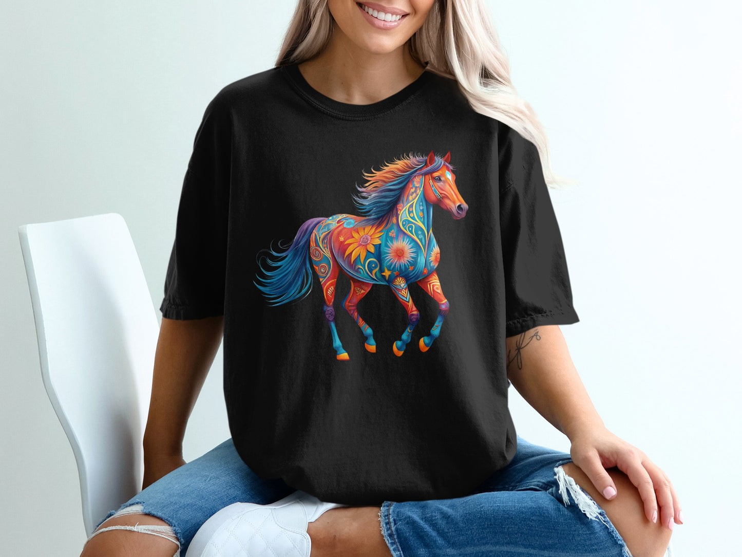 Black t-shirt with a colorful, ornate horse graphic.