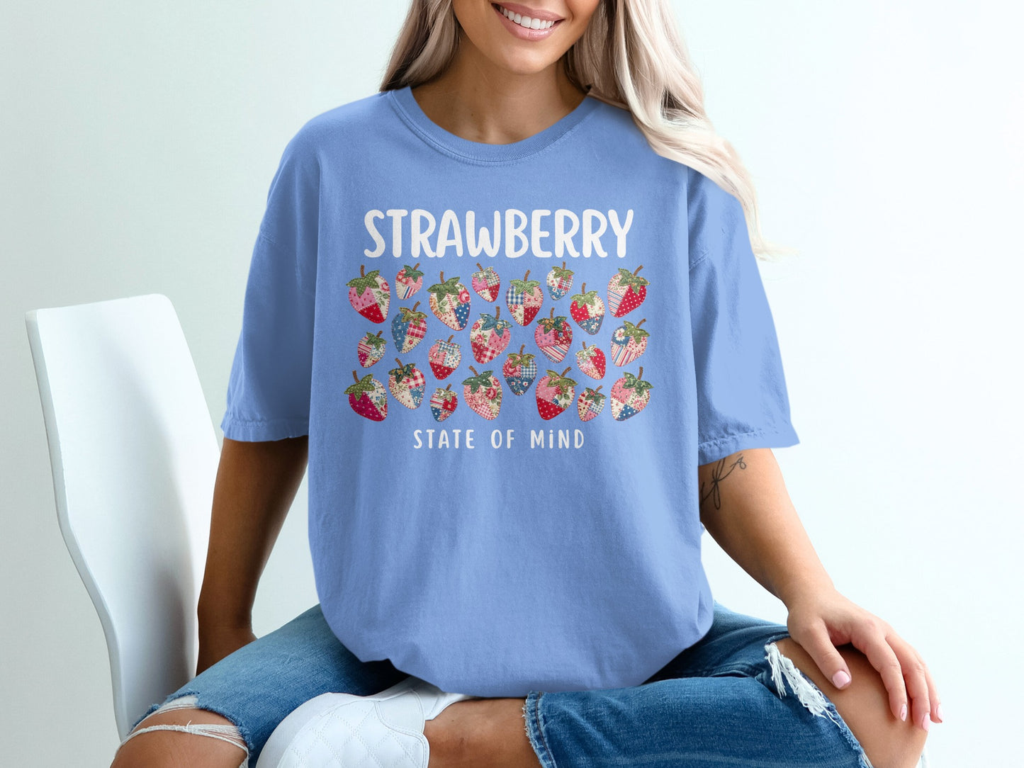 Light blue t-shirt with "STRAWBERRY STATE OF MIND" and patterned strawberries.
