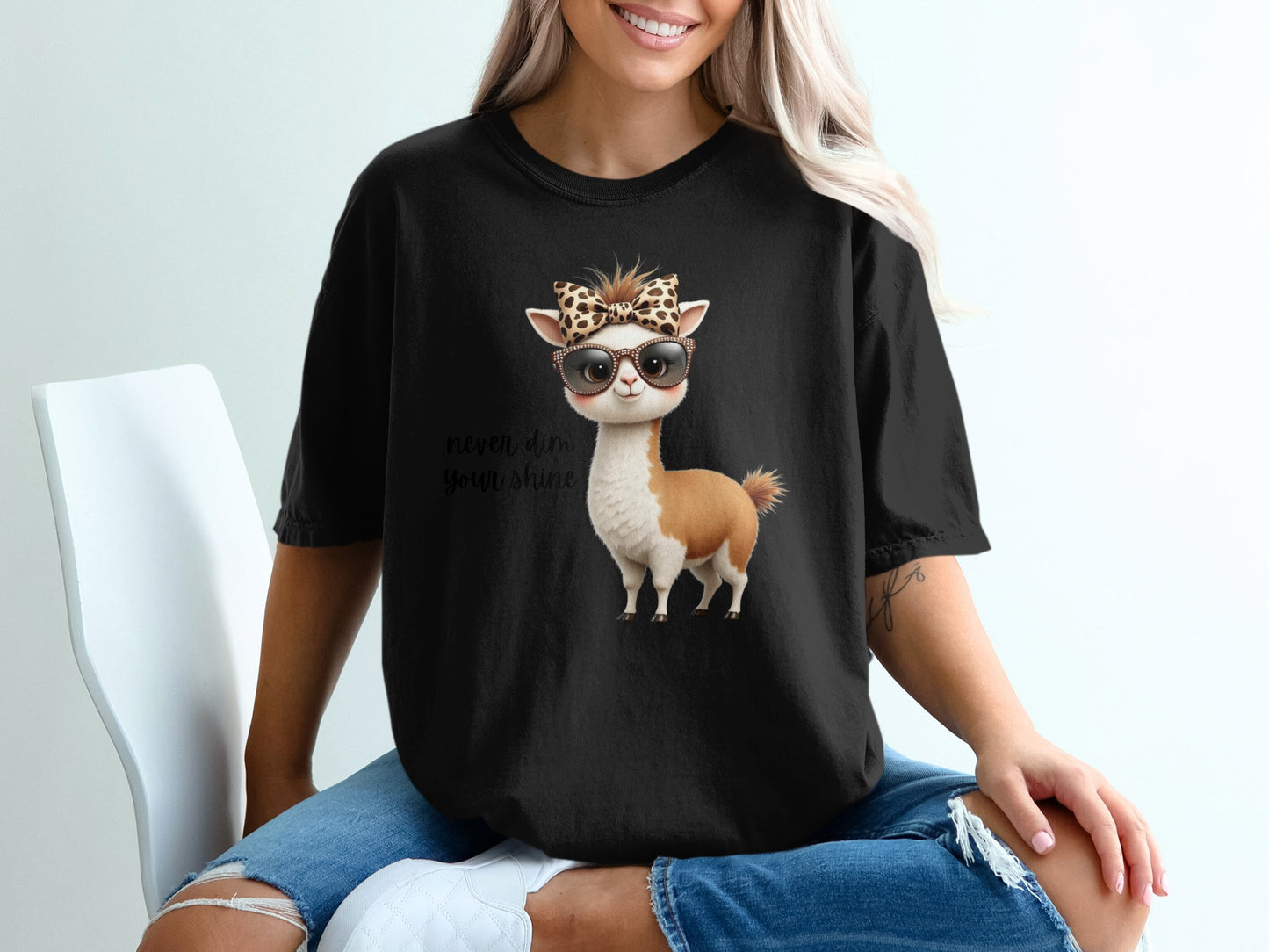 Black t-shirt with llama wearing sunglasses and leopard print bandana.
