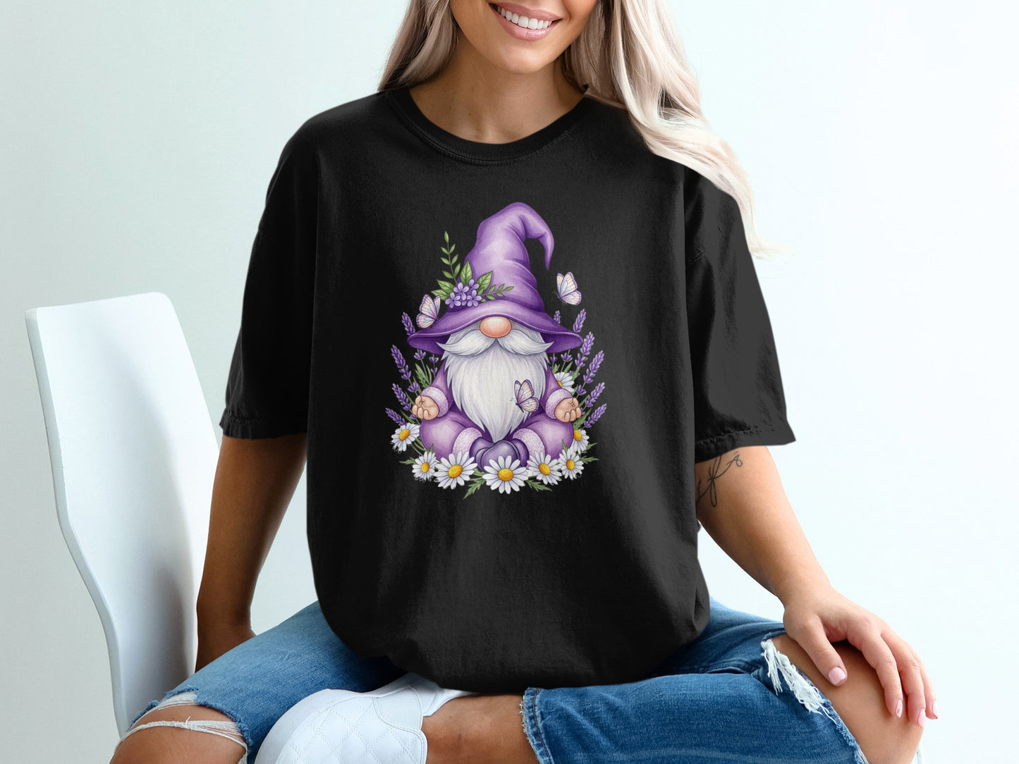 Black t-shirt with gnome and lavender floral graphic.