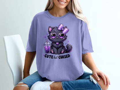 Purple t-shirt with a black cat wearing heart sunglasses and a bow, holding a drink.