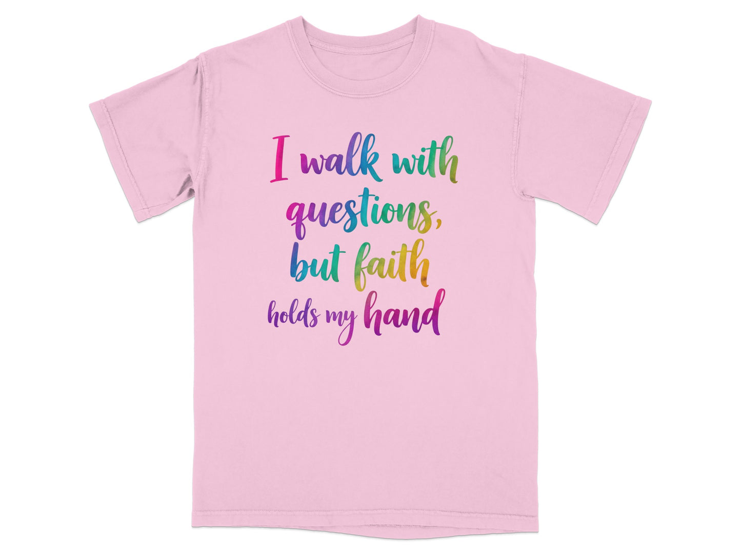 Pink t-shirt with rainbow text: "I walk with questions, but faith holds my hand."