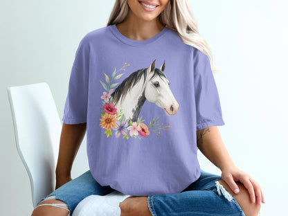Purple t-shirt with watercolor horse head and floral accents.