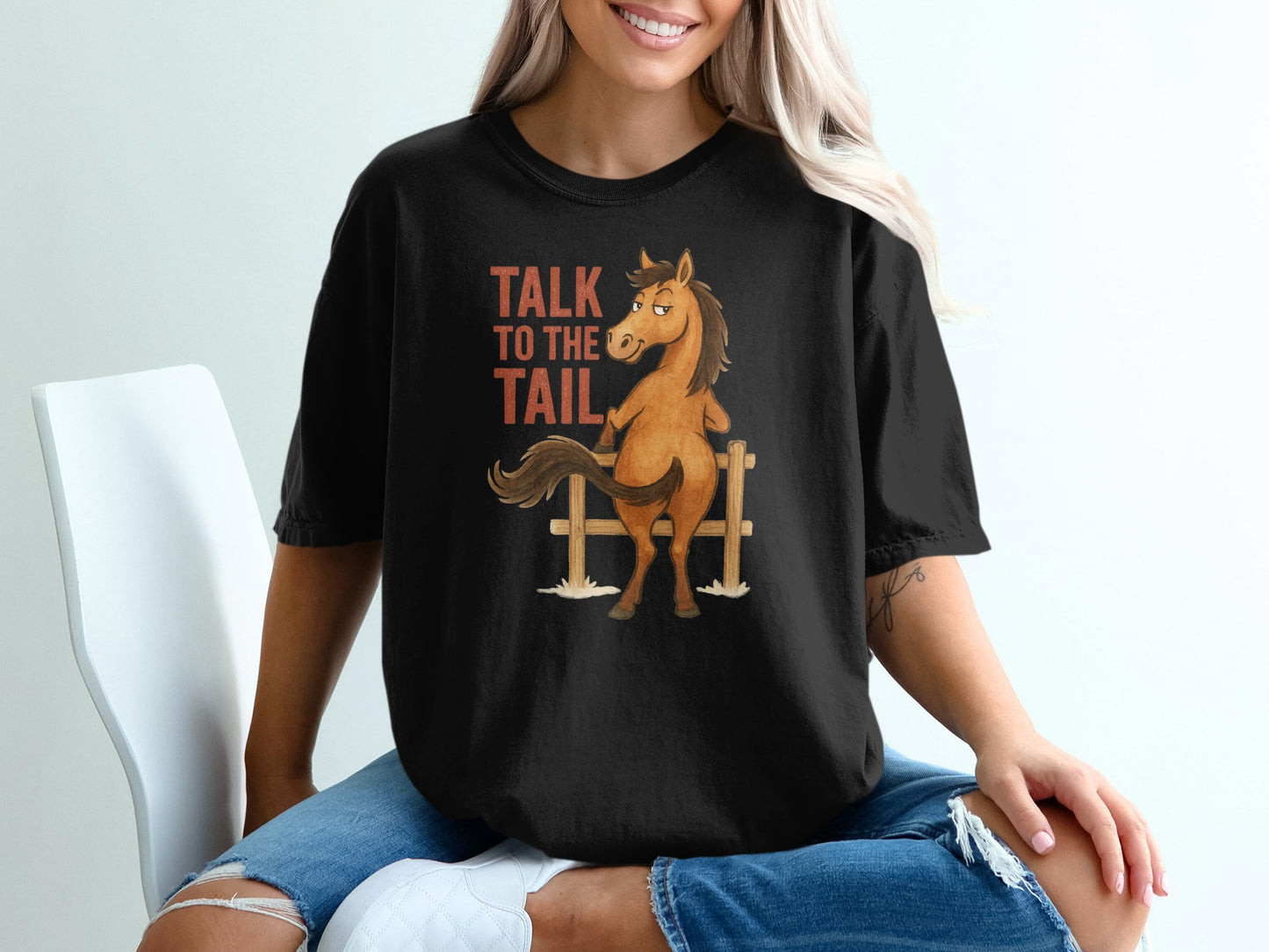 Black t-shirt with cartoon horse and "Talk to the Tail" text.