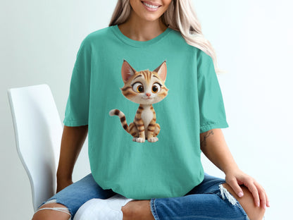 Cartoon cat graphic on a teal t-shirt worn by a person.