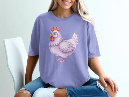 Purple t-shirt with a watercolor illustration of a white chicken.