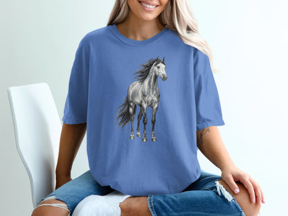 Blue t-shirt with a graphic of a gray horse in motion.